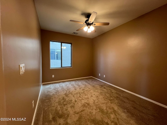 carpeted empty room with ceiling fan