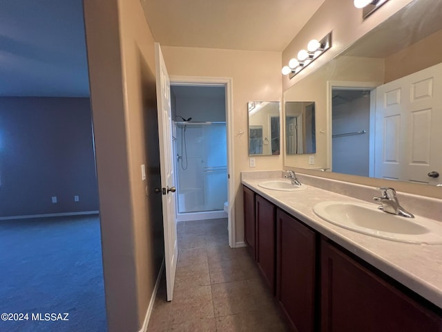 bathroom with an enclosed shower, vanity, and toilet