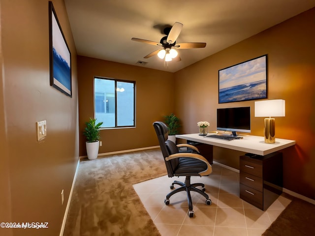 carpeted home office with ceiling fan