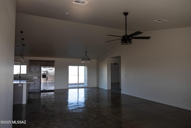 unfurnished living room with sink, high vaulted ceiling, and ceiling fan