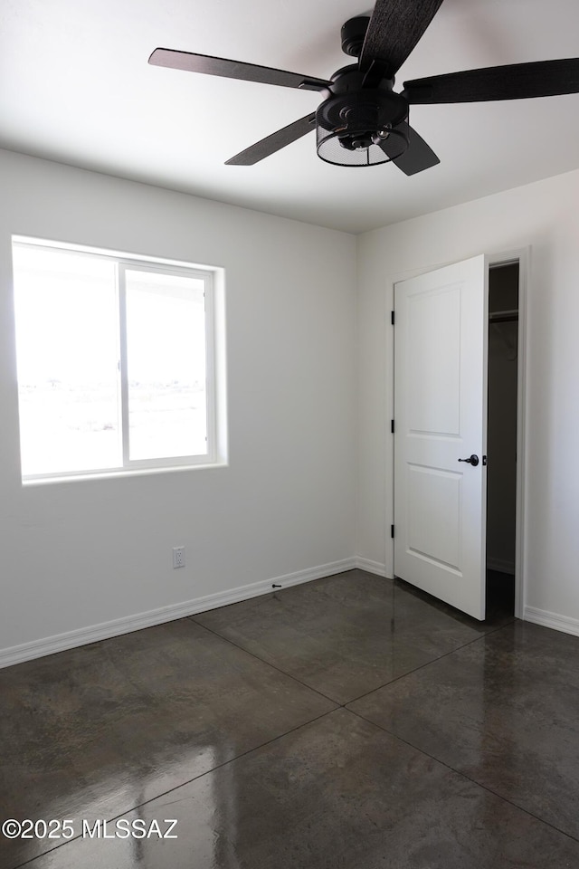 unfurnished room featuring ceiling fan