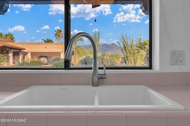 room details featuring a mountain view and sink