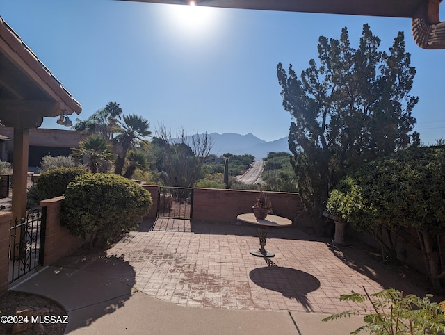 view of patio / terrace featuring a mountain view