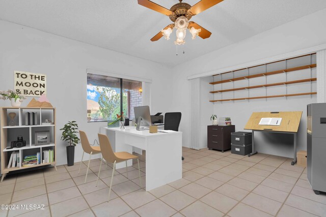 unfurnished room featuring a textured ceiling, sink, light colored carpet, and ceiling fan with notable chandelier