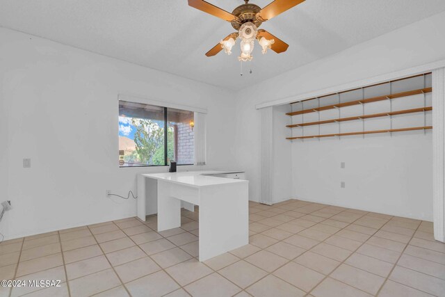 tiled office with ceiling fan