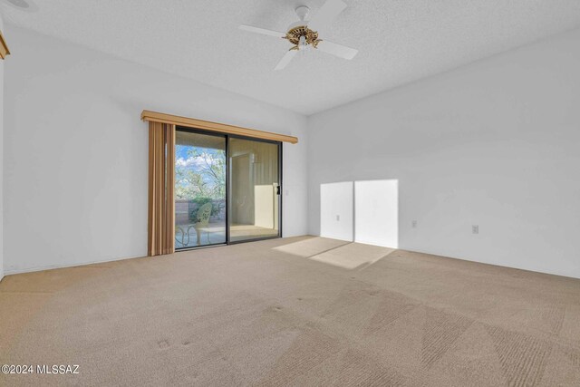 bedroom featuring ceiling fan, access to exterior, carpet floors, and a textured ceiling