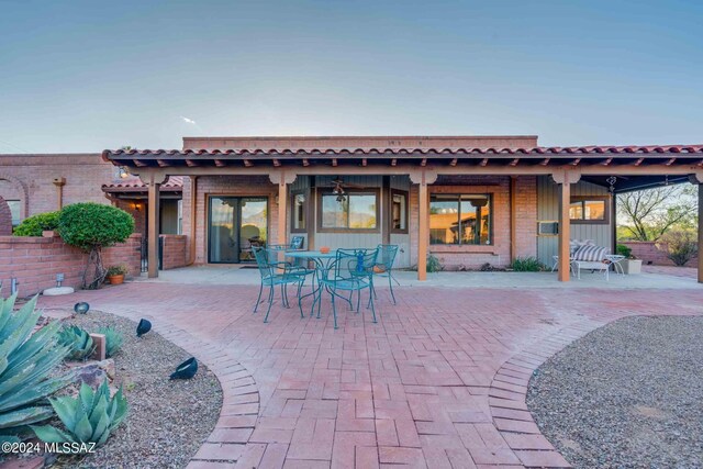 view of patio terrace at dusk