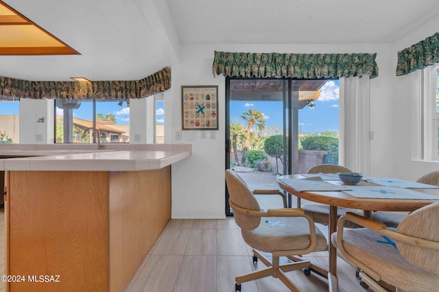 tiled dining area with sink