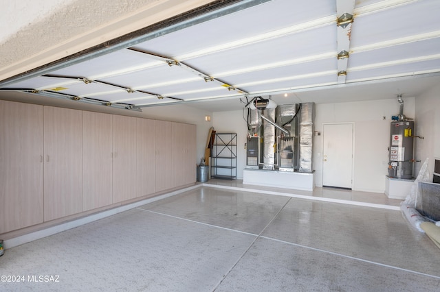 garage featuring gas water heater and a garage door opener