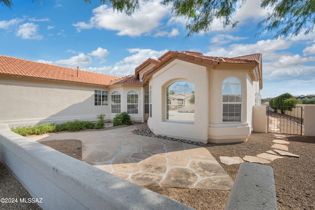 rear view of house featuring a patio area