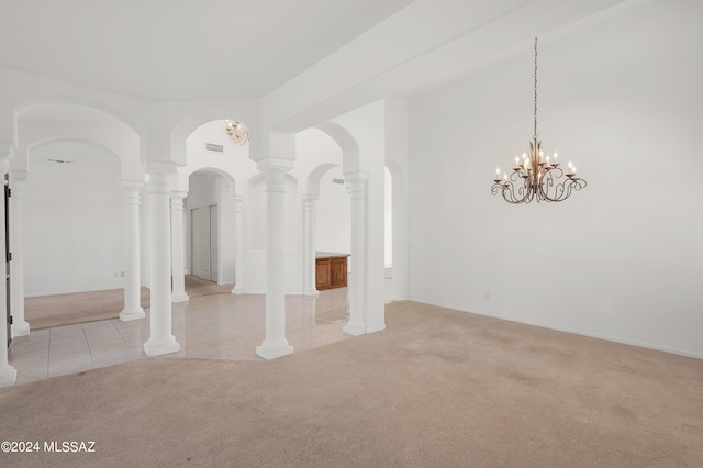 carpeted empty room with ornate columns