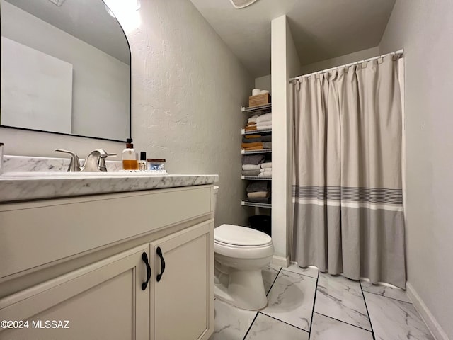 bathroom featuring vanity, toilet, and tile patterned flooring