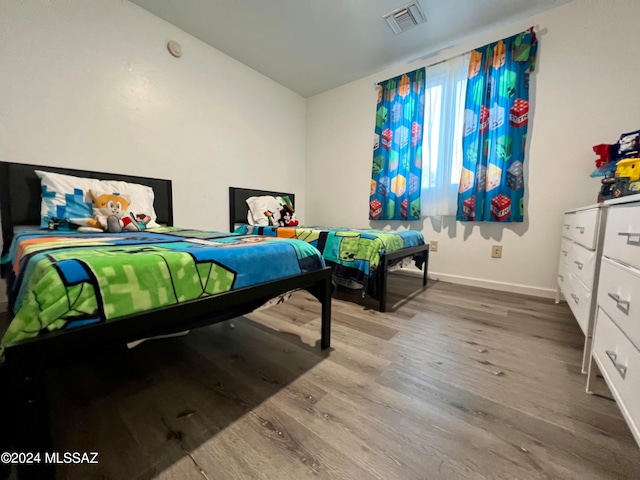 bedroom featuring hardwood / wood-style flooring