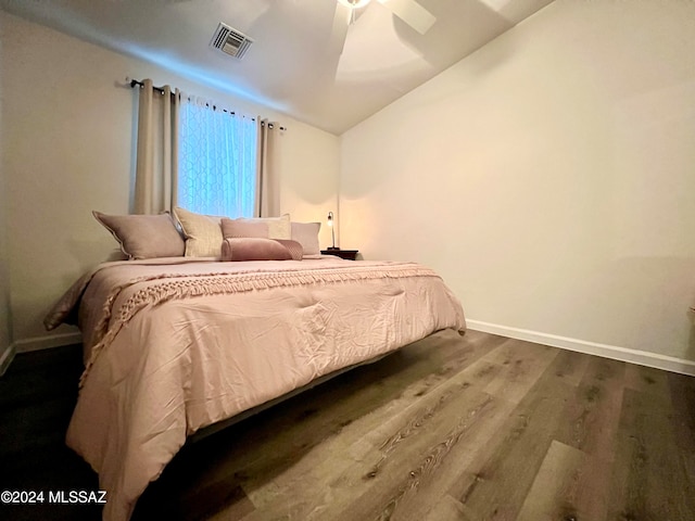 bedroom featuring lofted ceiling, hardwood / wood-style floors, and ceiling fan