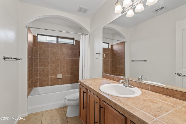 full bathroom with tile patterned flooring, vanity, toilet, and shower / bathtub combination with curtain