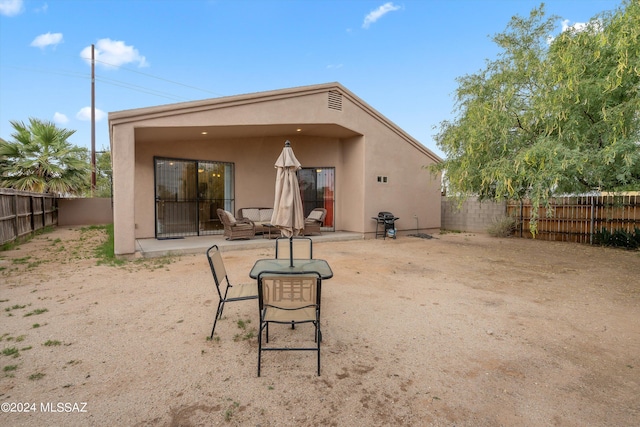 rear view of house with a patio area