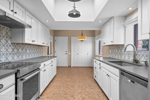 kitchen with sink, stainless steel appliances, and white cabinetry