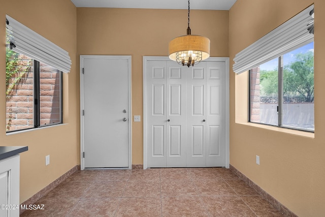 foyer with light tile patterned flooring