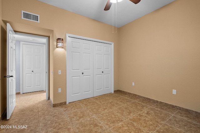 unfurnished bedroom with a closet and ceiling fan