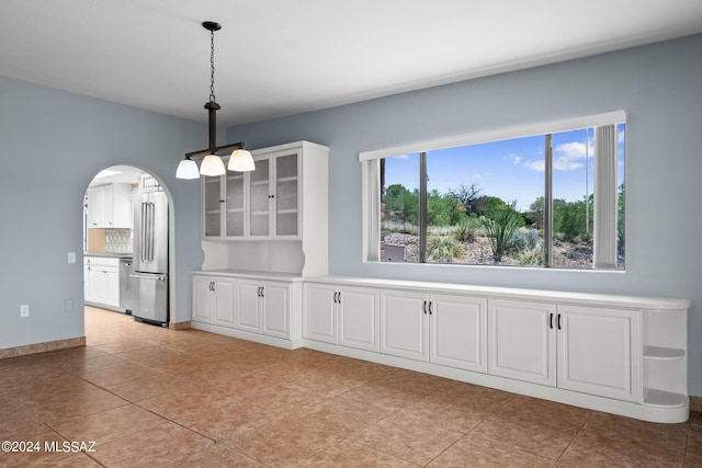 unfurnished dining area with light tile patterned floors