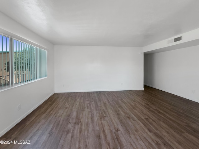 empty room featuring dark hardwood / wood-style floors