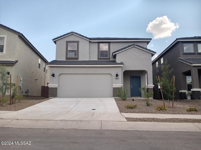 front facade with a garage