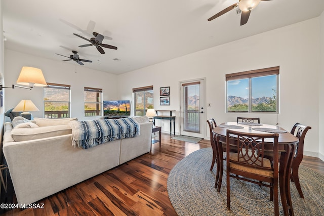 dining space featuring a wealth of natural light, ceiling fan, and dark wood-type flooring