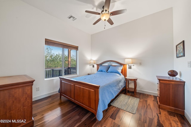 bedroom with ceiling fan and dark hardwood / wood-style floors