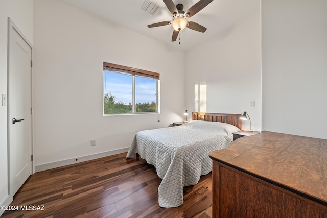 bedroom featuring ceiling fan and dark wood-type flooring