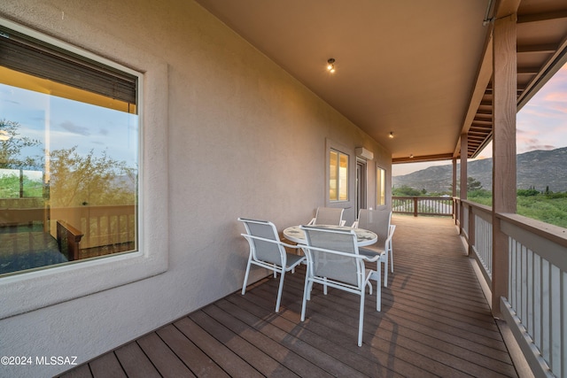 deck at dusk with a mountain view