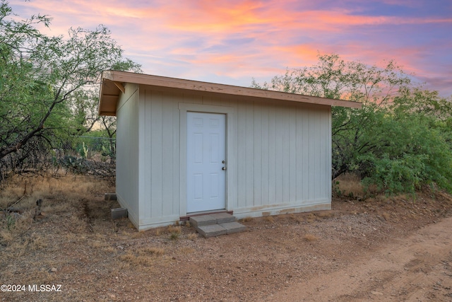 view of outdoor structure at dusk