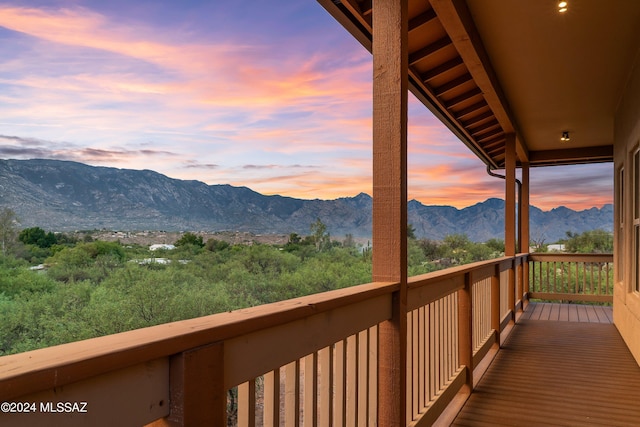 balcony at dusk with a mountain view