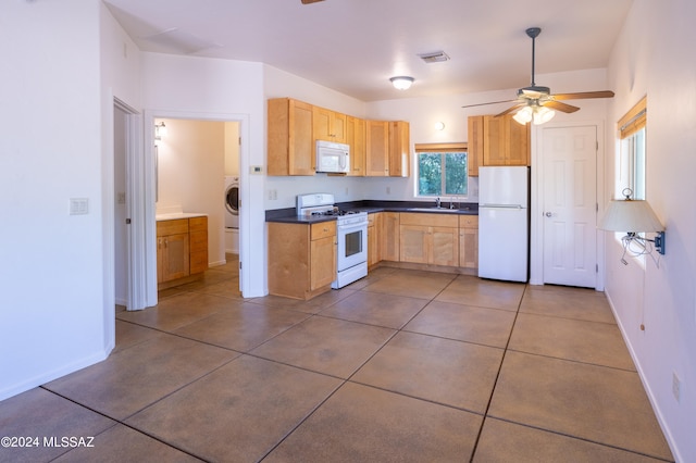 kitchen with ceiling fan, washer / dryer, tile patterned floors, sink, and white appliances