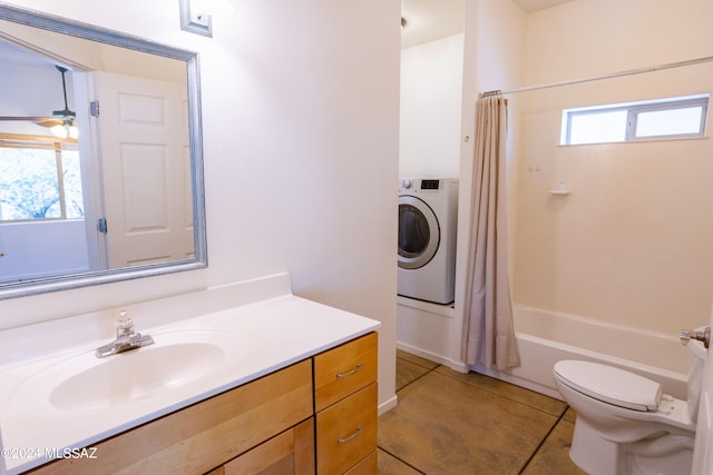 full bathroom featuring shower / bath combo with shower curtain, tile patterned flooring, vanity, washer / clothes dryer, and toilet