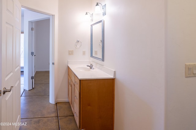 bathroom featuring tile patterned flooring and vanity