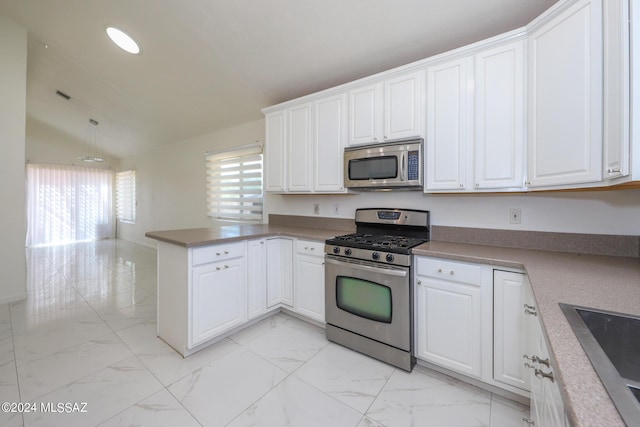 kitchen featuring kitchen peninsula, stainless steel appliances, lofted ceiling, white cabinets, and sink