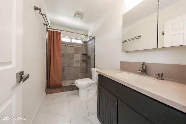 bathroom with toilet, vanity, and a shower with curtain