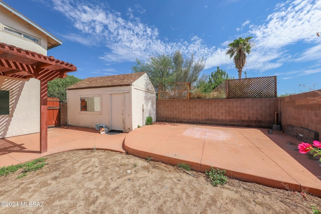 view of patio / terrace with a shed