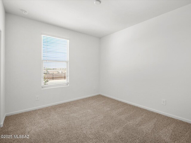 350 N Pecan Canyon Ln, Sahuarita, AZ 85629 - carpeted empty room featuring baseboards and a smoke detector