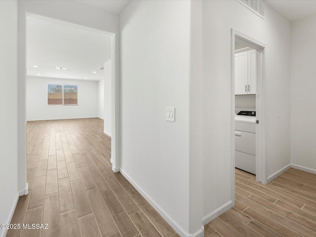 350 N Pecan Canyon Ln, Sahuarita, AZ 85629 - hall with washer / dryer, light wood-type flooring, baseboards, and recessed lighting