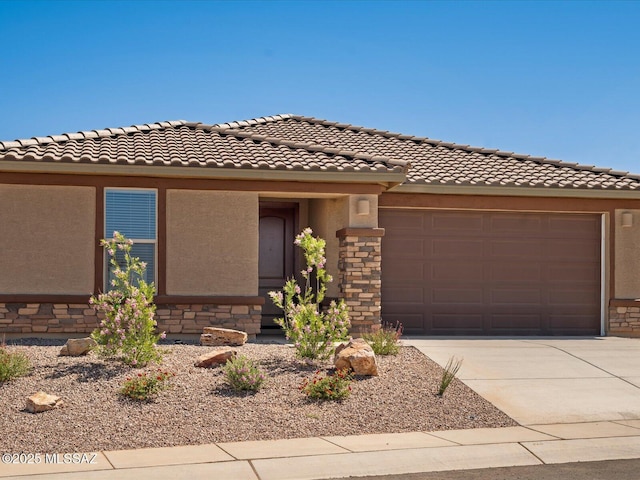 350 N Pecan Canyon Ln, Sahuarita, AZ 85629 - view of front facade with stone siding, stucco siding, concrete driveway, and a garage
