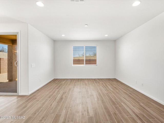 350 N Pecan Canyon Ln, Sahuarita, AZ 85629 - empty room featuring light wood-style floors, recessed lighting, and baseboards