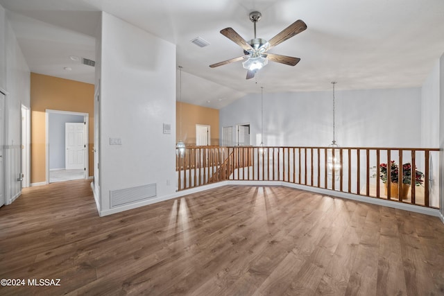 spare room featuring lofted ceiling, hardwood / wood-style floors, and ceiling fan