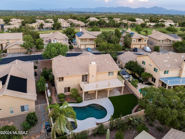 birds eye view of property with a mountain view