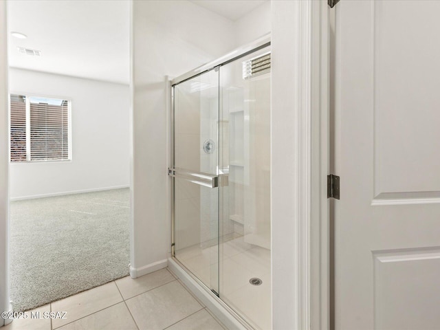 7005 W Jadewood Ln W, Tucson, AZ 85757 - bathroom featuring visible vents, baseboards, a shower stall, and tile patterned flooring
