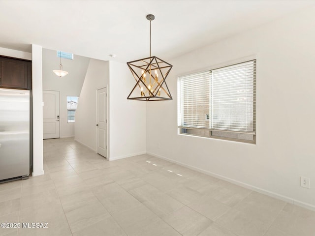 7005 W Jadewood Ln W, Tucson, AZ 85757 - unfurnished dining area with light tile patterned floors, visible vents, and baseboards