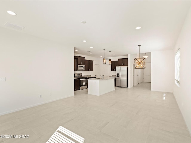 7005 W Jadewood Ln W, Tucson, AZ 85757 - unfurnished living room featuring visible vents, recessed lighting, baseboards, and a sink