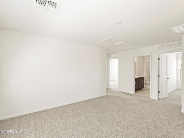 7005 W Jadewood Ln W, Tucson, AZ 85757 - empty room featuring visible vents, light colored carpet, and attic access