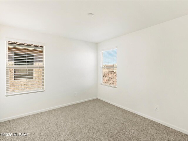 7005 W Jadewood Ln W, Tucson, AZ 85757 - unfurnished room featuring baseboards and carpet floors