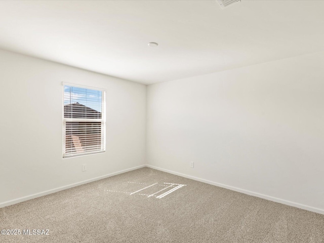 7005 W Jadewood Ln W, Tucson, AZ 85757 - unfurnished room featuring carpet flooring and baseboards